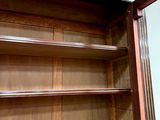 a wooden cabinet with a door open on the floor