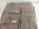 several bags of brown cloth sitting on top of a white table