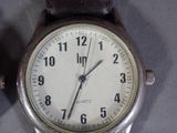 a close up of a wrist watch on a table