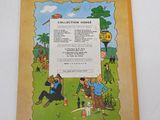 an old children ' s book with a picture of a man and a woman sitting on a bench