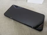 a cell phone that is laying on the floor