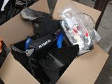 a cardboard box filled with assorted items on the street