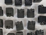 a lot of different types of metal parts on the table