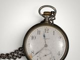 a close up of a pocket watch with a chain around it