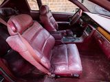 a red car that is sitting in the back of the car