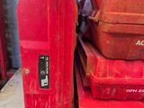 many red boxes stacked on top of each other on a table