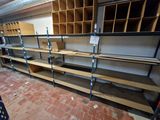 many shelves that are in the middle of a room