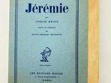 an old book with a blue cover sitting on top of a table