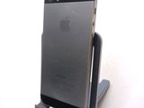 a cell phone that is sitting on top of a stand