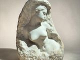 marble sculpture of a woman ' s head on a rock