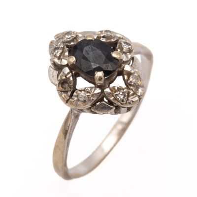 an image of a black diamond ring on a white background