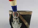 a small cup with a red, white, and blue stick sticking out of it
