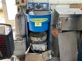 a man that is standing in front of a machine