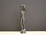 statue of a man holding his head in his hands