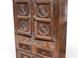 an old wooden cabinet with many drawers and drawers on top of it