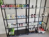 a shelf with many different types of paint on it