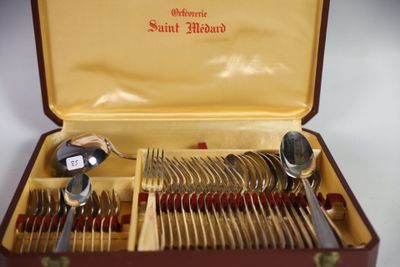 a box with silverware in it on a table