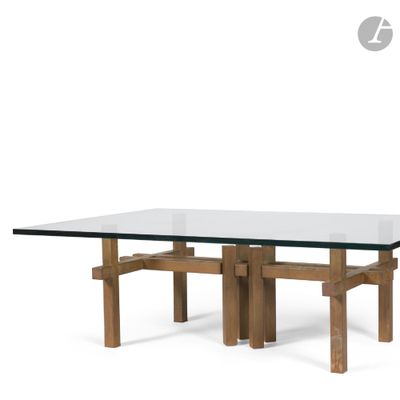 a glass table with wooden legs and a glass top