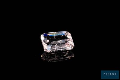 a close up of a diamond on a black surface