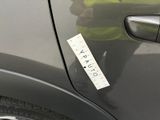 a sticker on the door of a car that says caution