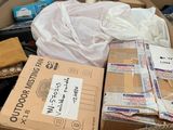 a large box full of boxes of clothing and other items