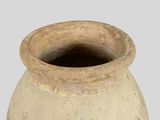 a large clay vase with a black lid on a white background