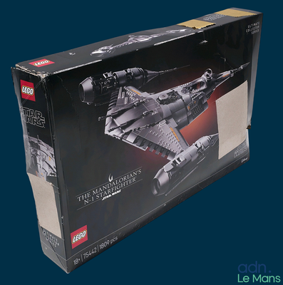 a box with a model of a space ship in it