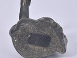 a small statue of a bird that is sitting on top of a rock