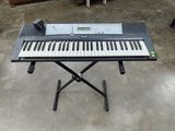 a keyboard that is sitting on a stand in a room