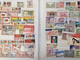 many different stamps on the pages of a book