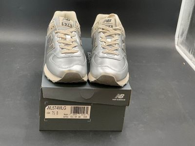 brand new balance shoes in a box on a black surface