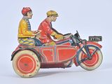 two figurines of two men riding on a motorcycle