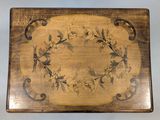 a wooden box with a floral design on it