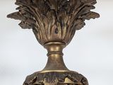an antique brass chandelier hanging from the ceiling of a house