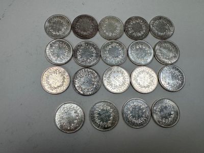 several different types of coins are arranged on a table