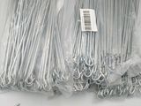 a bunch of hooks and a pair of scissors on a table