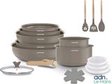 a lot of bowls and pans that are on the table