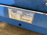a label on the back of a machine that is sitting on a table