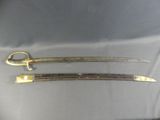 pair of gold - plated swords from the late 19th century