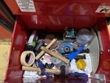 a red tool box filled with tools and other items