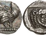 a close up of a coin with a bird on it