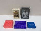 two boxes of playing cards and a box of playing cards