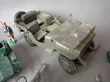 a toy army jeep and a toy army vehicle