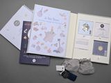 a book with a picture of a baby ' s first book and a pair of shoes