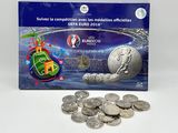 the euro coin is sitting next to a pile of coins