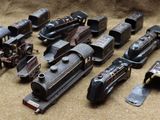 a lot of old toy trains sitting on a table