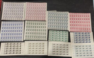 a table topped with lots of different types of stamps on top of each other