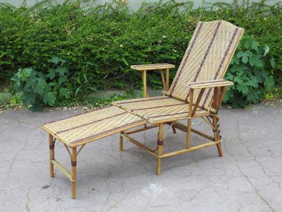 a reclining chair and a side table on a patio