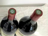 three bottles of wine sitting next to each other on a table