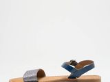 a picture of a pair of blue sandals with two straps